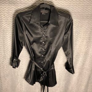 Shiny black button down shirt.